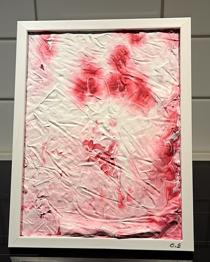 Abstrakt konst i en fotoram.