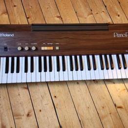 Retro elpiano i behov av reparation